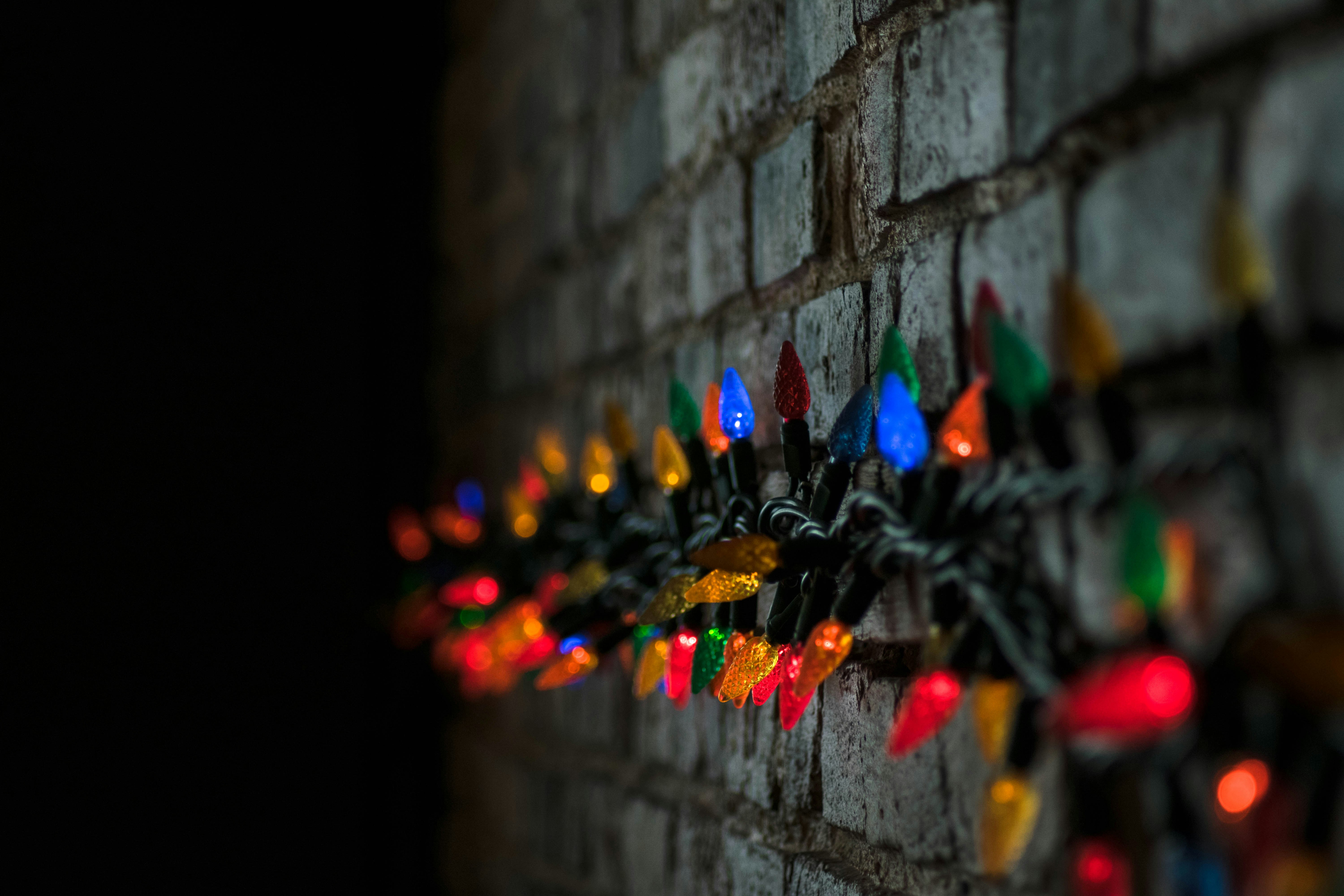 shallow focus photography of string lights at the wall